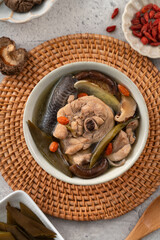 Delicious Taiwanese peeled green chili pepper chicken soup with mushroom and goji berry.