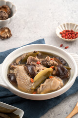 Delicious Taiwanese peeled green chili pepper chicken soup with mushroom and goji berry.