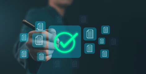 Digital document approval concept with businessman selecting green check mark icon on virtual interface, representing successful verification, quality assurance, and online data management.