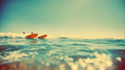 Fototapeta premium Two Paddleboards Floating Tranquilly in the Ocean Waves on a Sunny Summer Day