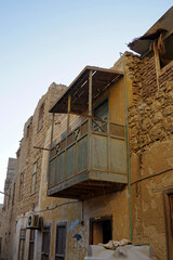 Dilapidated old wooden balcony in El Quseir