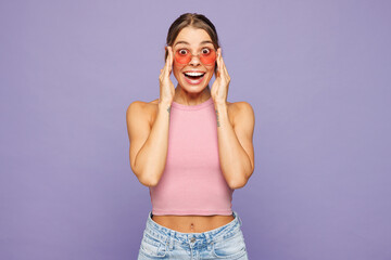 Young happy shocked surprised excited woman she wears pink tank top casual clothes sunglasses...