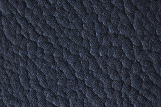 A macro close-up showcasing the rich, intricate textures of textile, tapestry, and leather materials