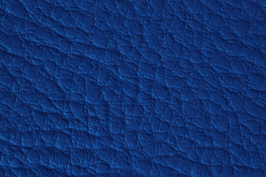 A macro close-up showcasing the rich, intricate textures of textile, tapestry, and leather materials