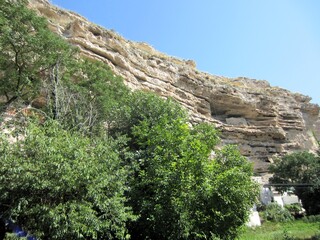 inland cliff with erosion and vegetation