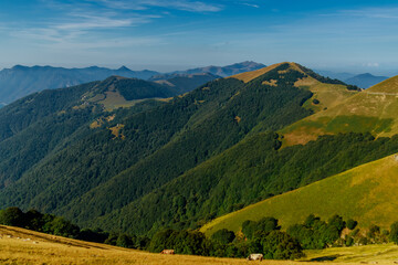 Scenic view of the mountains surrounding Como lake from Monte di Tremezzo on a sunny summer day