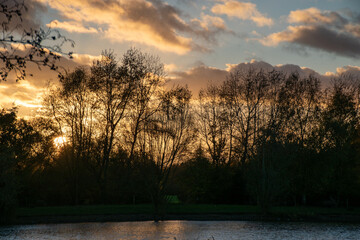 Beautiful sunset over a lake at Rushcliffe Country Park in Nottinghamshire, UK.