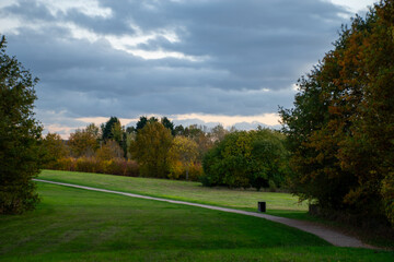 Landscape with a beautiful sunset and trees in autumn color at Rushcliffe Country Park in Nottingham, UK.