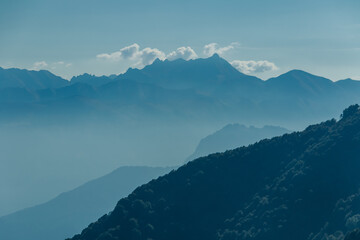 Scenic view of the mountains surrounding Como lake from Monte di Tremezzo on a sunny summer day