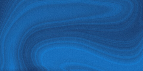 Abstract close up of a textured dark blue surface with subtle light and shadow variations creating a gradient effect