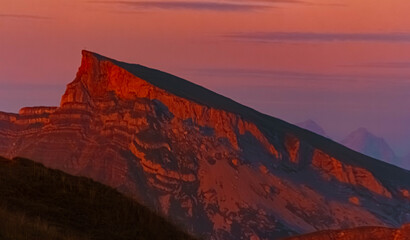 Alpine sunset or sundowner with amazing geological layers in rock formations and Mount Hoher Ifen seen from Mount Diedamskopf, Schoppernau, Bregenz, Vorarlberg, Austria