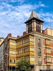 Sunlit urban scene in Pamplona with mixed architecture