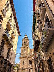 Sunlit urban scene in Pamplona with mixed architecture