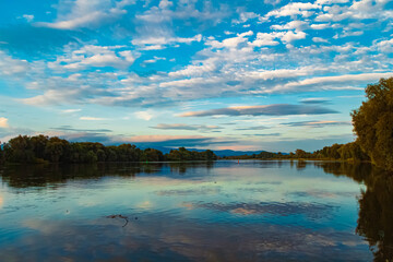 Beautiful summer evening view with reflections at Stephansposching, Danube, Deggendorf, Bavaria, Germany
