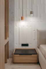 Bedroom with a bed, bedside table and lamps