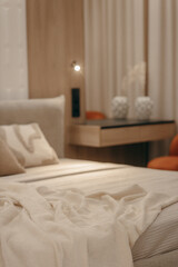 Bedroom with a bed, bedside table and lamps