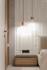 Bedroom with a bed, bedside table and lamps