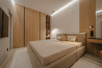 Bedroom with a bed, bedside table and lamps