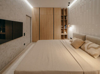 Bedroom with a bed, bedside table and lamps