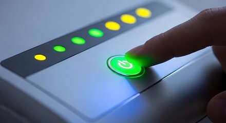 Turning on a household or office device. Power control and standby mode activation. Person's finger pressing a glowing green on and off button on a white machine