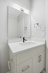 Bathroom with a white sink and a mirror