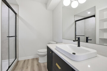 Bathroom with a white sink and toilet