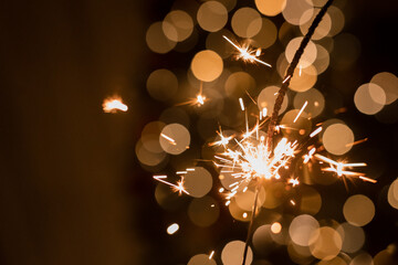 sparklers in children's hands on New Year's Eve