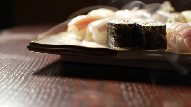 Close-up of assorted sushi rolls on a wooden table