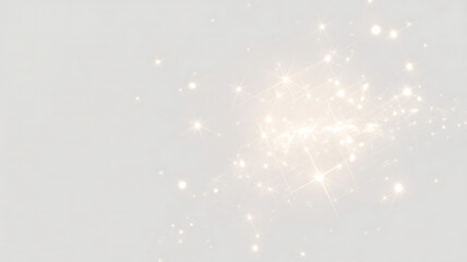 A cluster of bright, sparkling light particles emanating from a central point on a light gray backdrop