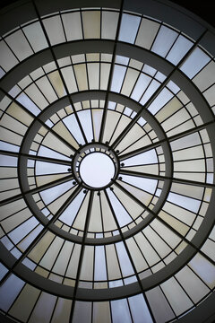 Geometric skylight with circular patterns and soft light illuminating through. Munich, Germany