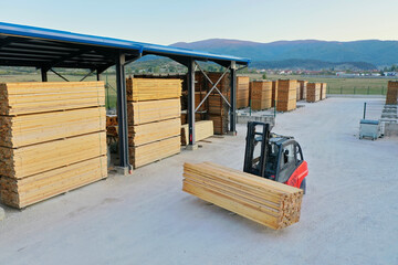 Forklift Moving Timber Boards at Modern Lumber Facility