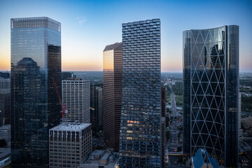 Urban skyline at sunset featuring modern skyscrapers and cityscape view. Calgary, Alberta, Canada