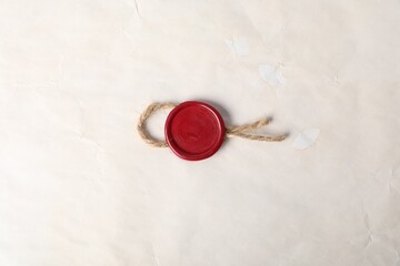 Old parchment paper with wax seal as background, top view