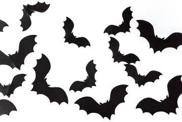 Black bats on a white background. Halloween holiday concept