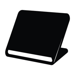 Black silhouette of a book, standing open on a surface in perspective