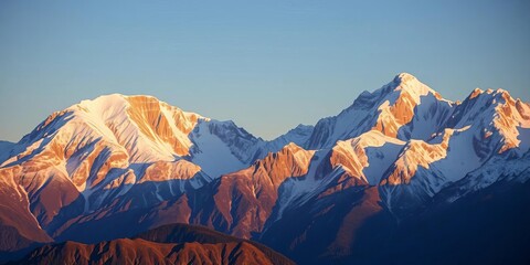 Majestic mountain range at sunrise, snow-capped peaks reflecting golden light, powerful, sunrise