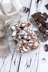 Homemade chocolate, lemon, and mint crackled cookies and crispy red velvet with sugar on a white plate. Food style. 