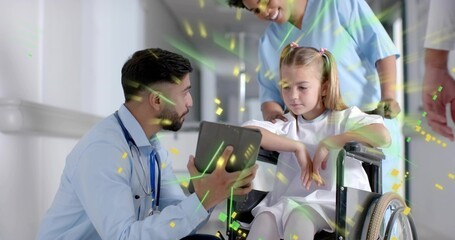 Pushing nurse in scrubs guiding patient in gown down hospital corridor, with wheelchair and tablet
