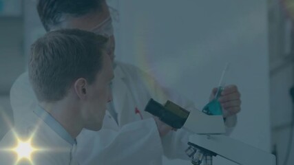 Lab scientist focusing microscope as mentor tilting flask causing glare fading as analyzing sample - Powered by Adobe