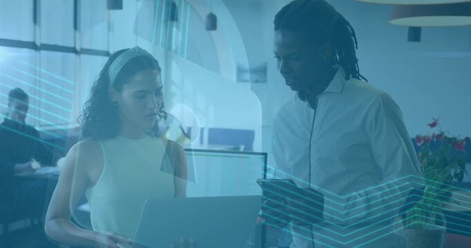 Woman carrying laptop walking to coworker scrolling and animating business charts showing progress