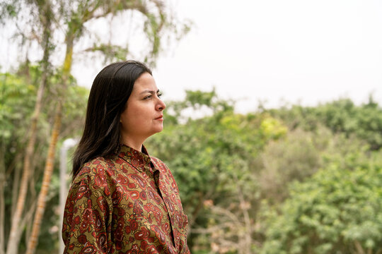 Contemplating woman enjoying peaceful moment in nature
