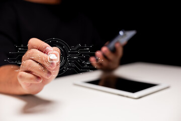 A person interacting with a digital interface, showcasing modern technology and connectivity through touch and devices like a smartphone and tablet.
