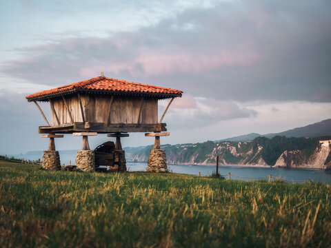 Galician granary at sunset facing the ocean