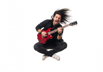Energetic young man with long dark hair playing a red electric guitar while jumping isolated on transparent background
