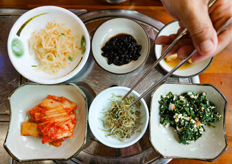 Assorted Korean side dishes in a restaurant in Jeju Island.