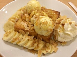 Honey Toast. Bread buttered toast. Topped with ice-cream decorations in white plate