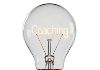 Vintage Edison-style light bulb with glowing 'Coaching' filament, isolated on a transparent, shadowless background with warm incandescent glow. Concept of innovation, clarity, and mentorship