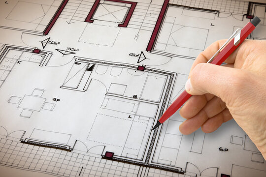 Architect drawing a planimetry of a residential building