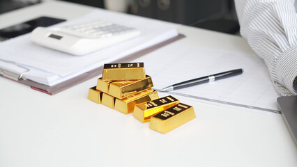 Fototapeta premium Silver Trading Businessman invest in trading silver, calculating price and monitoring online using smartphone