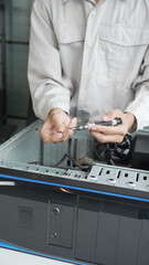 Closeup hand of computer hardware technician dissemble and  fixing computer PC.